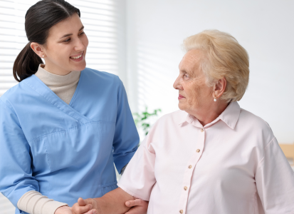 NDIS support worker helping older participant with daily tasks